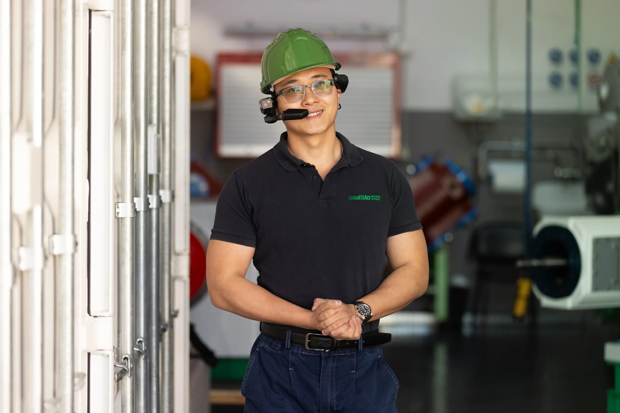 SIAD employee wearing safety helmet and AR device inside the compressor room